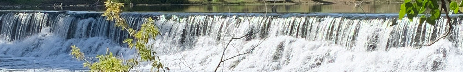 Waterfall flows into stream picture